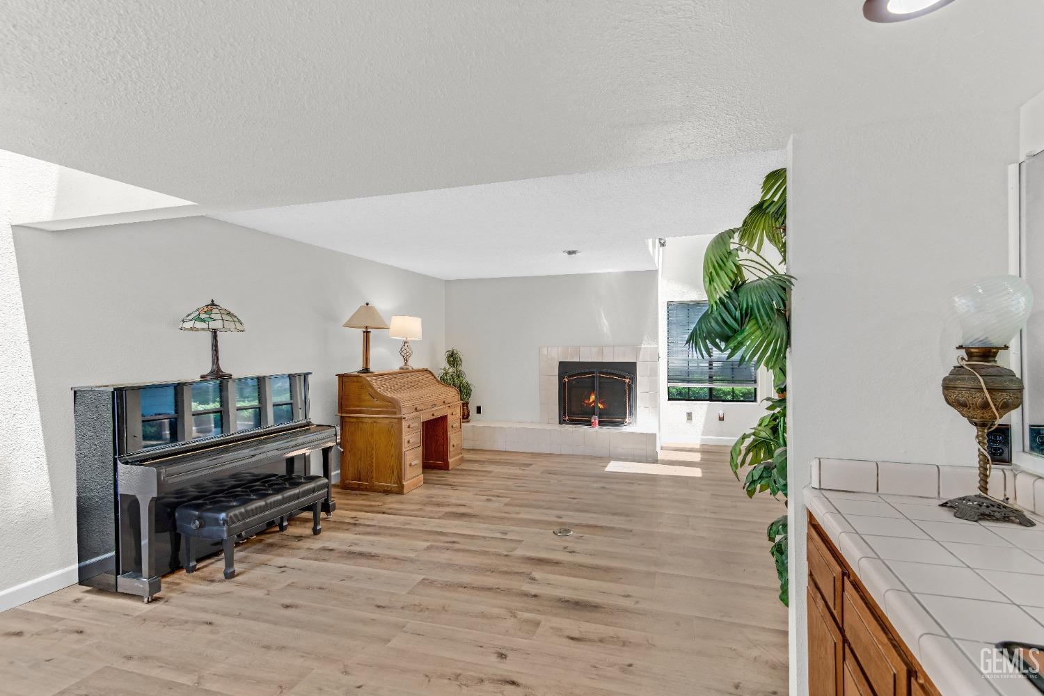 Undisclosed Address Bakersfield, CA 93309 - Photo 17 of 38 a living room with furniture and a fireplace
