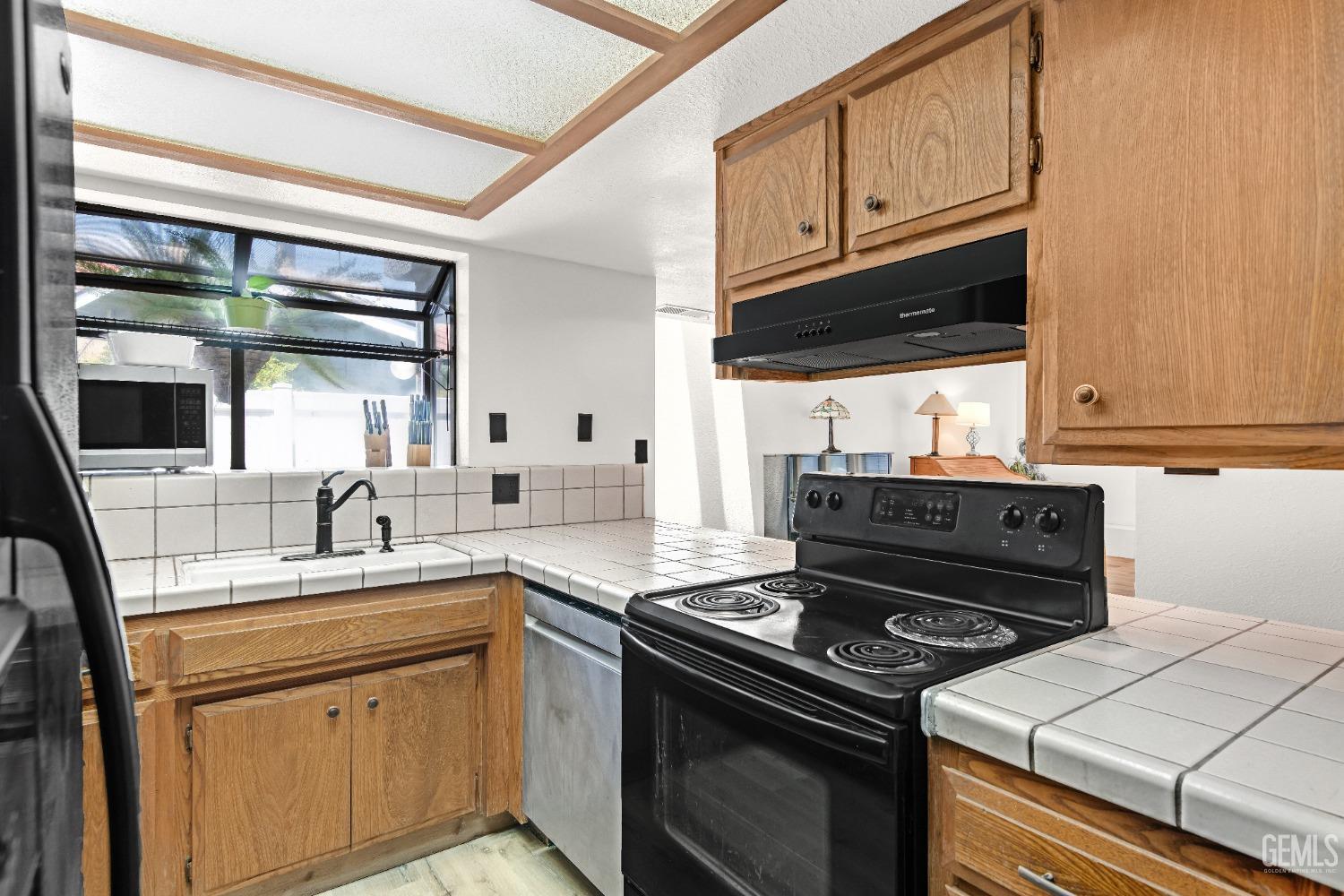 Undisclosed Address Bakersfield, CA 93309 - Photo 20 of 38 a kitchen with a stove and a sink