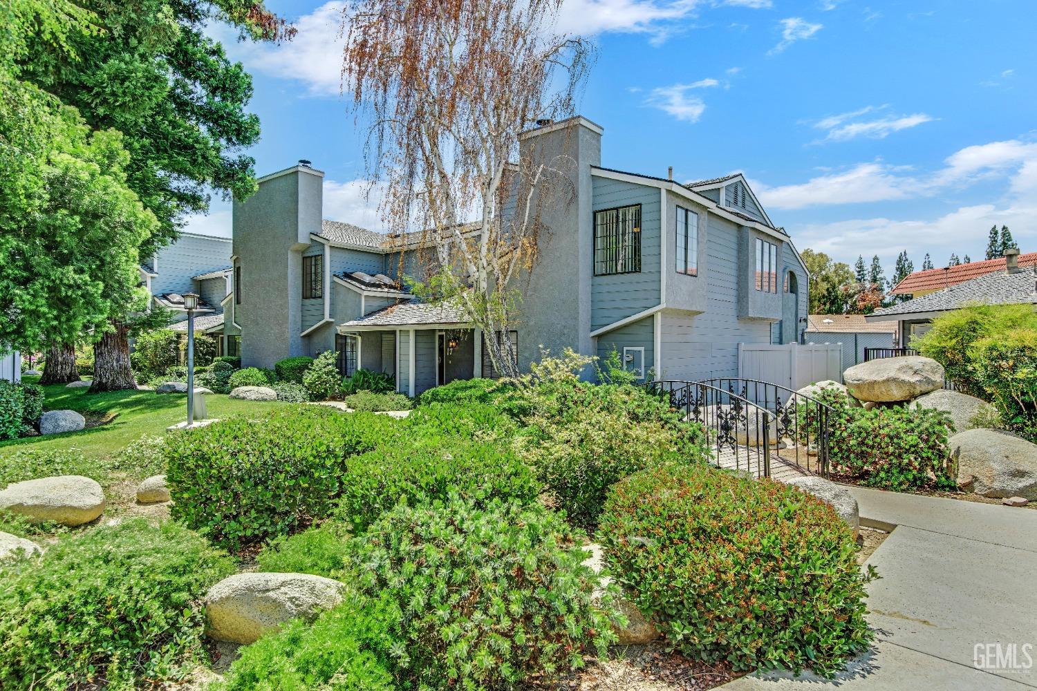 Undisclosed Address Bakersfield, CA 93309 - Photo 2 of 38 a front view of a house with a yard
