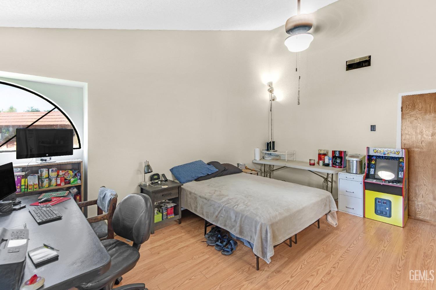 Undisclosed Address Bakersfield, CA 93309 - Photo 26 of 38 a bedroom with a bed and a flat screen tv