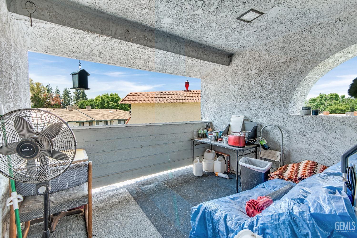 Undisclosed Address Bakersfield, CA 93309 - Photo 27 of 38 a living room with furniture and a potted plant