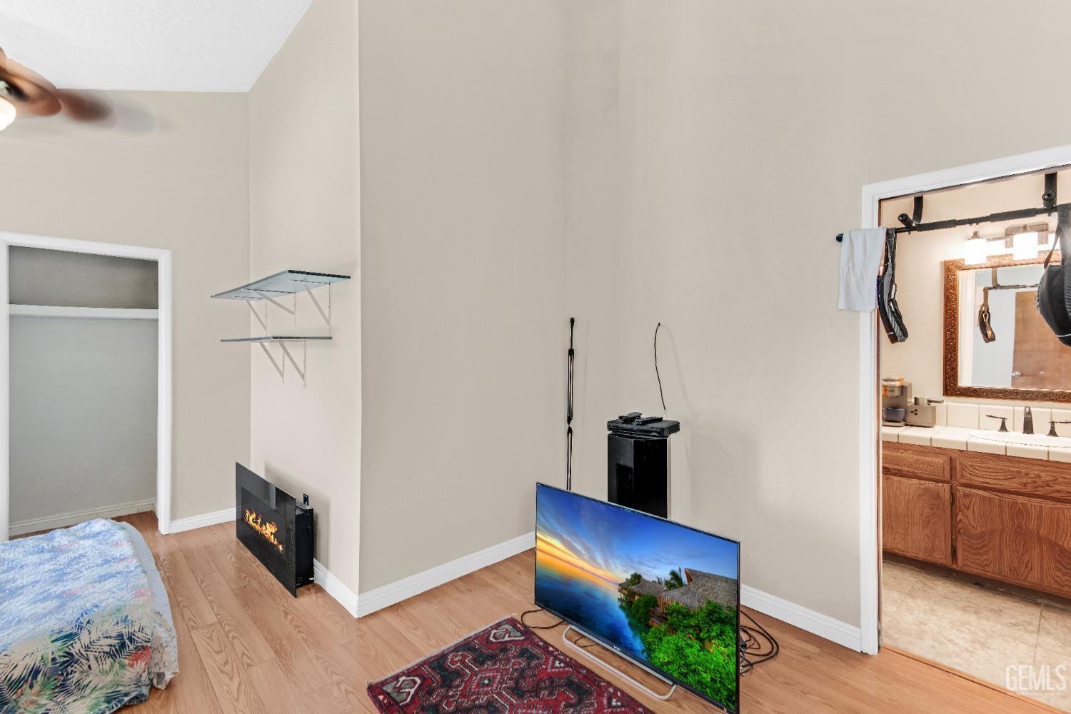 Undisclosed Address Bakersfield, CA 93309 - Photo 31 of 38 a bedroom with furniture and a fireplace