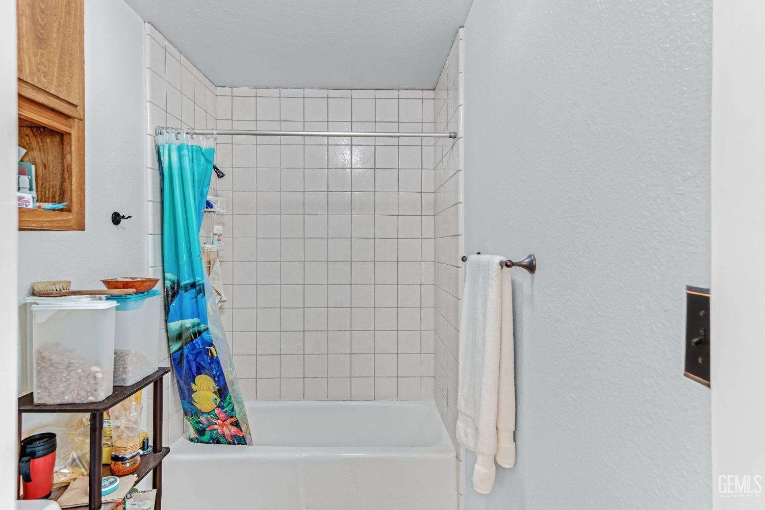 Undisclosed Address Bakersfield, CA 93309 - Photo 33 of 38 a bathroom with a bathtub and a shower