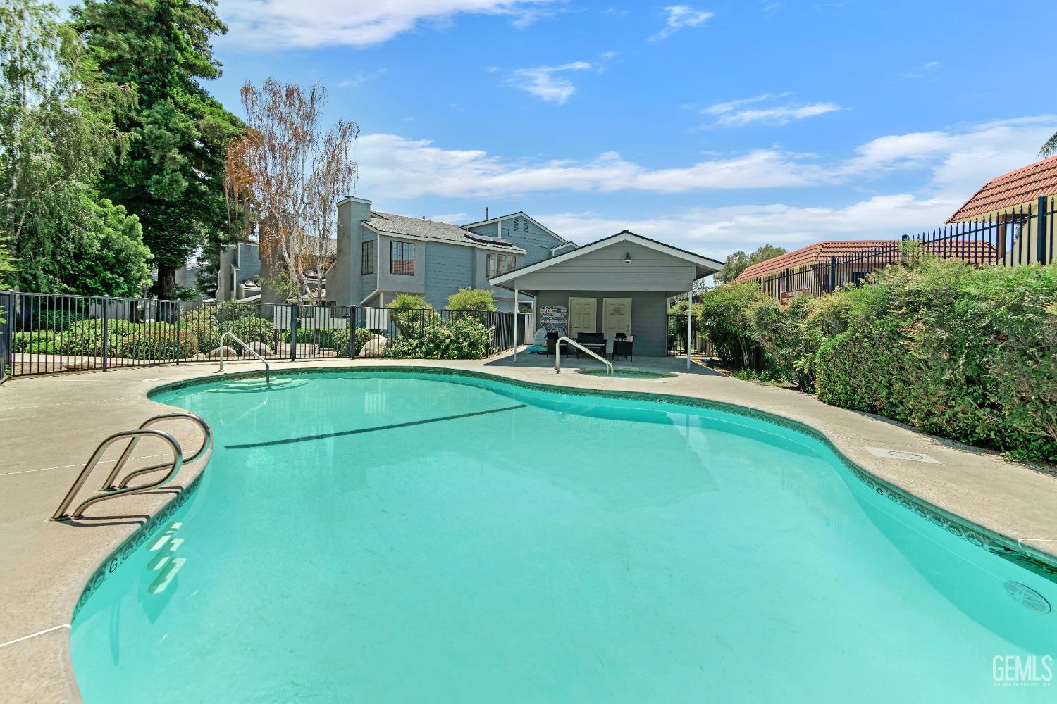 Undisclosed Address Bakersfield, CA 93309 - Photo 4 of 38 a swimming pool with barbeque oven in front of it