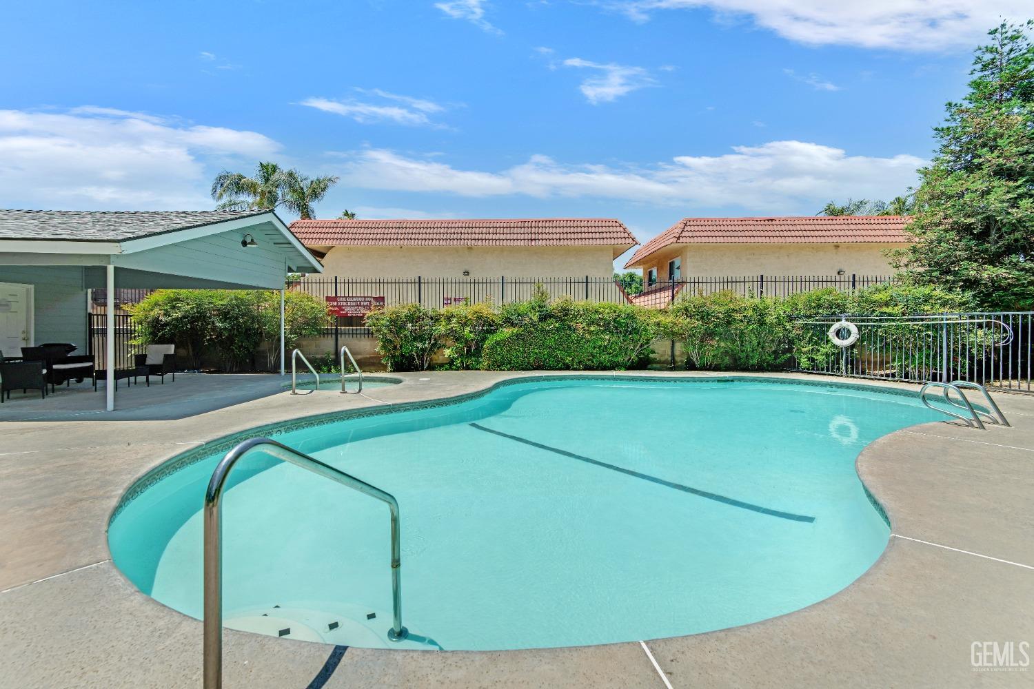 Undisclosed Address Bakersfield, CA 93309 - Photo 5 of 38 a view of a swimming pool with a patio