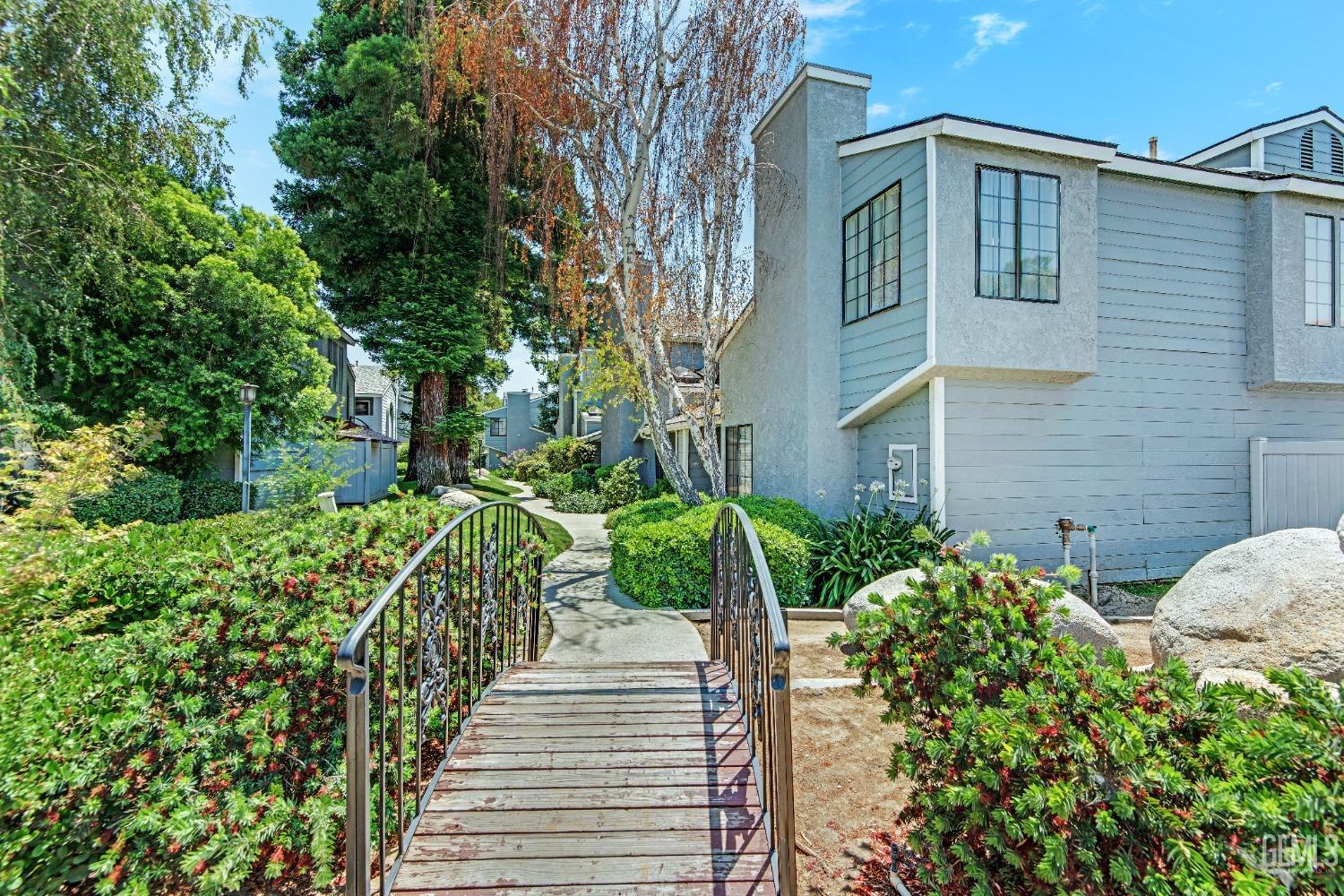 Undisclosed Address Bakersfield, CA 93309 - Photo 6 of 38 a front view of a house with a yard