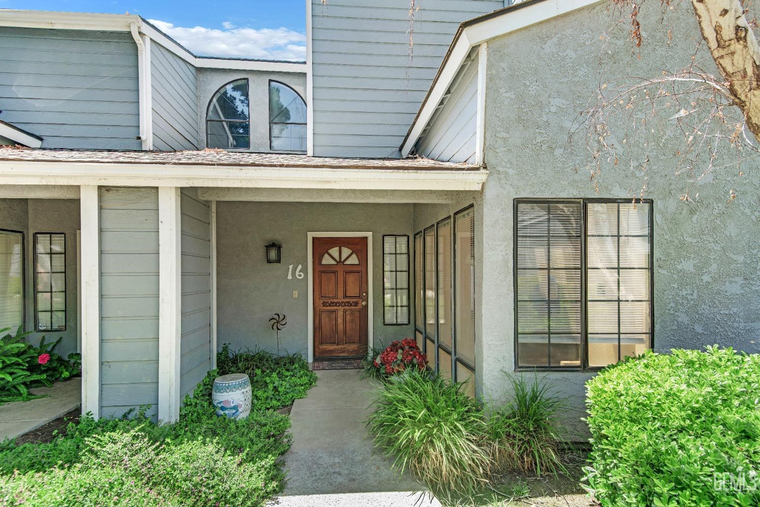 Undisclosed Address Bakersfield, CA 93309 - Photo 7 of 38 a view of a house with potted plants