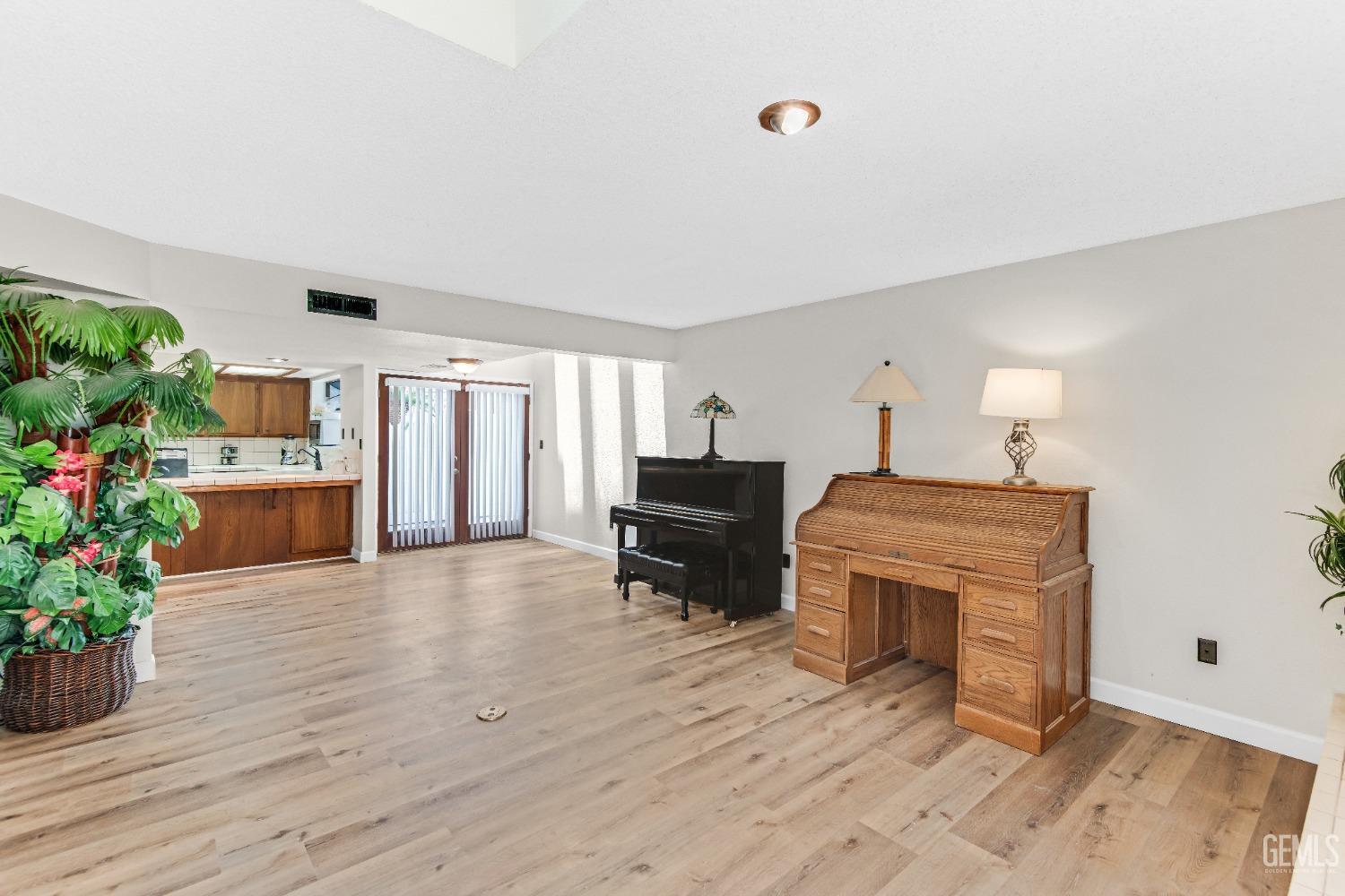 Undisclosed Address Bakersfield, CA 93309 - Photo 10 of 38 a living room with furniture and a fireplace