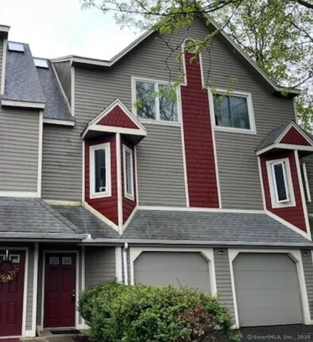 a front view of a house with yard