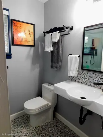 a bathroom with a sink a toilet and mirror