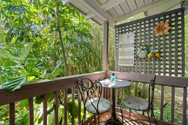 a view of a chairs and table in patio