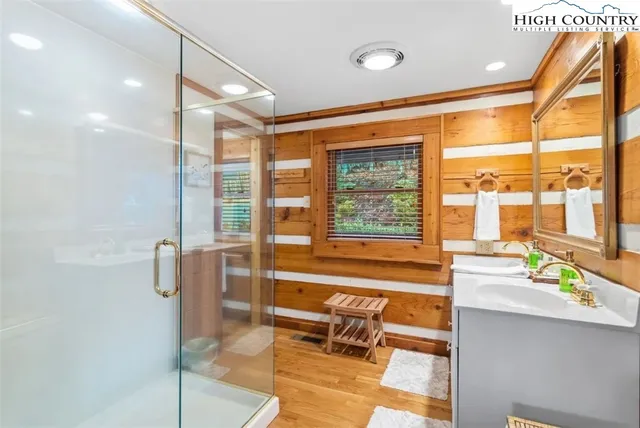 a spacious bathroom with a large tub and shower