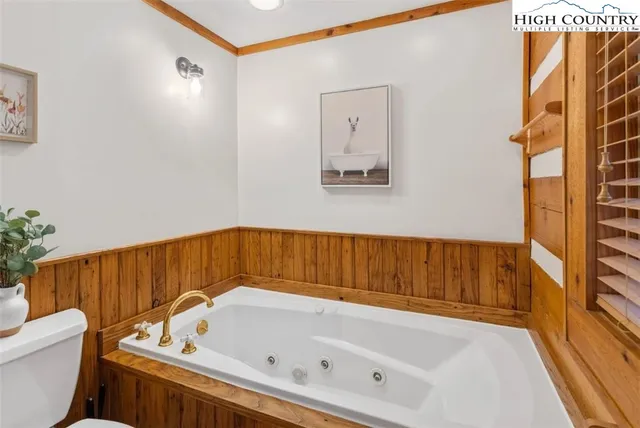 a bathroom with a bathtub and a toilet