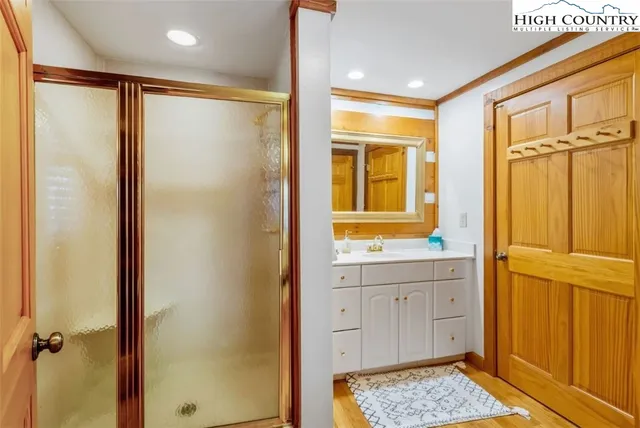 a bathroom with a shower and a sink