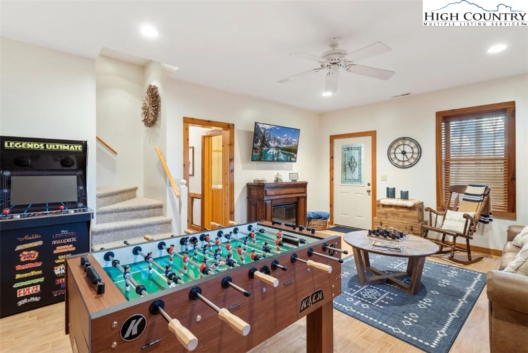 885 John Erwin Road Banner Elk, NC 28604 - Photo 17 of 50 a living room with fireplace furniture and a flat screen tv