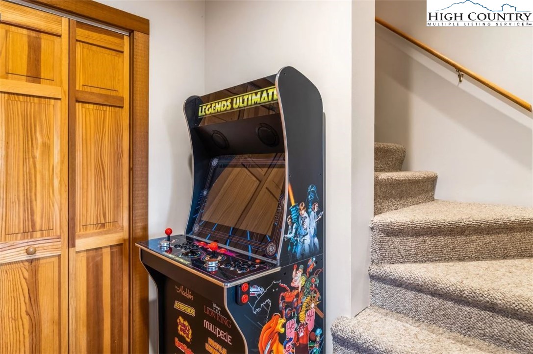 885 John Erwin Road Banner Elk, NC 28604 - Photo 18 of 50 a living room with a couch and a flat screen tv
