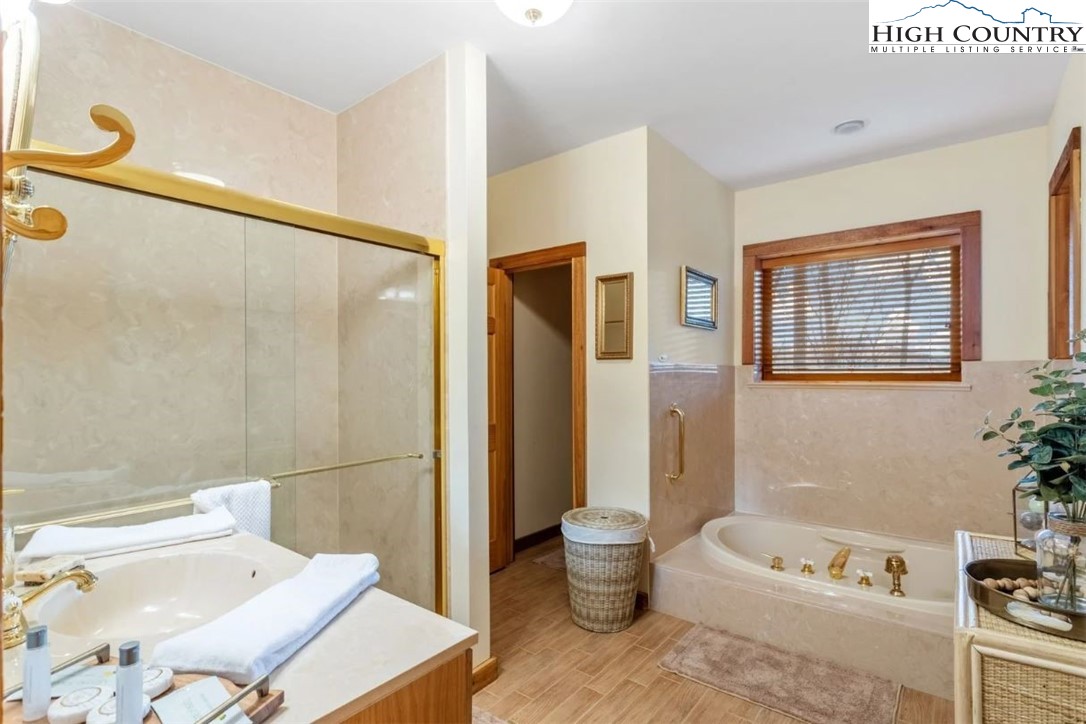 885 John Erwin Road Banner Elk, NC 28604 - Photo 24 of 50 a bath room with a toilet a bath tub and a shower