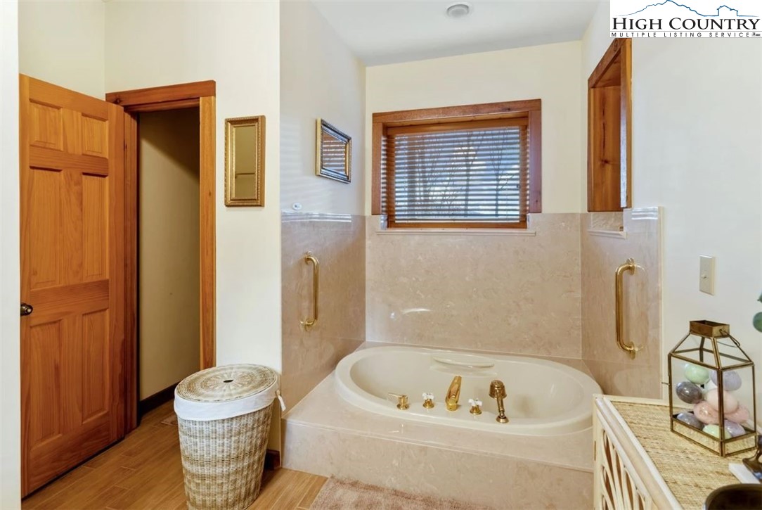 885 John Erwin Road Banner Elk, NC 28604 - Photo 25 of 50 a bathroom with a sink and a bathtub