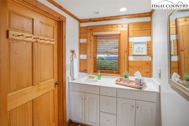 a bathroom with a sink and a window