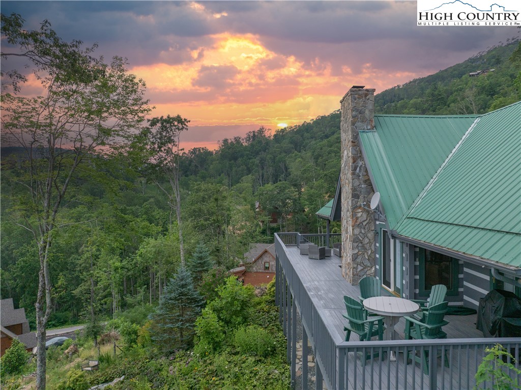 885 John Erwin Road Banner Elk, NC 28604 - Photo 28 of 50 a view of a balcony with wooden floor and fence