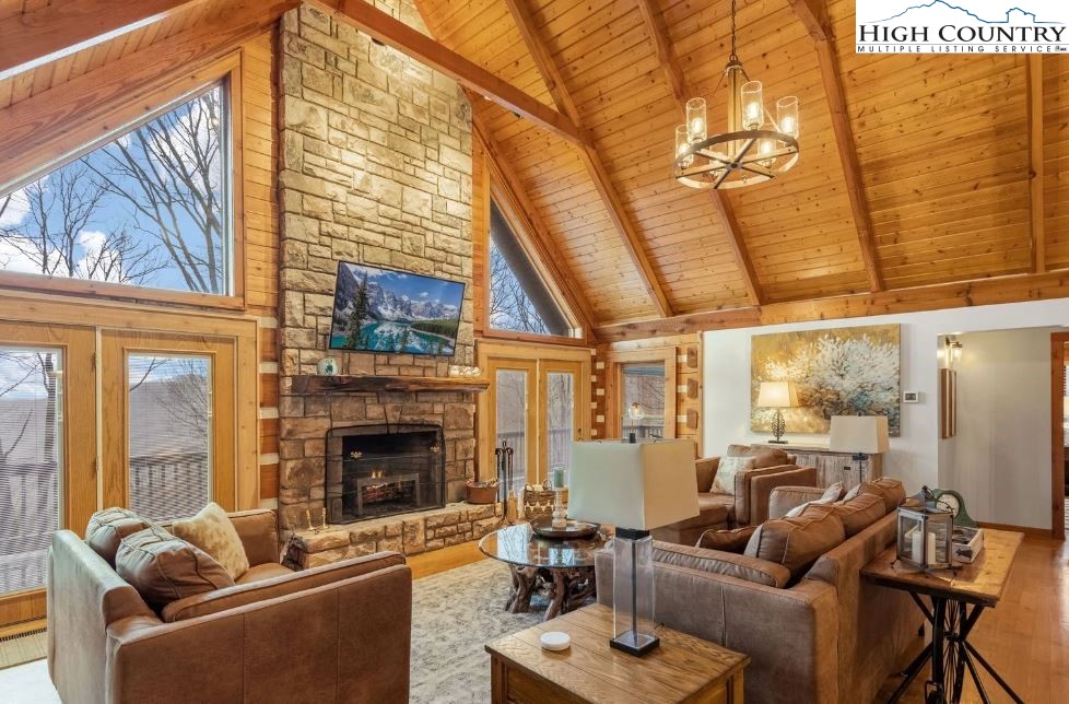 885 John Erwin Road Banner Elk, NC 28604 - Photo 3 of 50 a living room with furniture or fireplace and a wooden floor