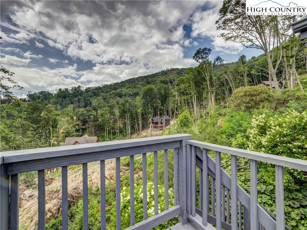 885 John Erwin Road Banner Elk, NC 28604 - Photo 33 of 50 a view of a balcony with trees