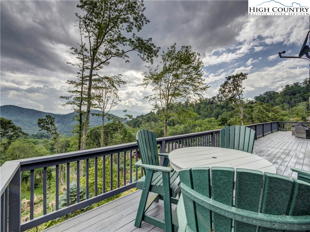 885 John Erwin Road Banner Elk, NC 28604 - Photo 36 of 50 a view of a balcony with table and chairs