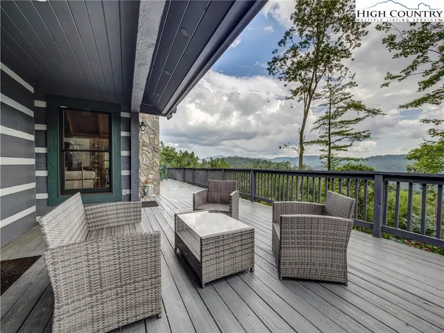 a view of roof deck with patio