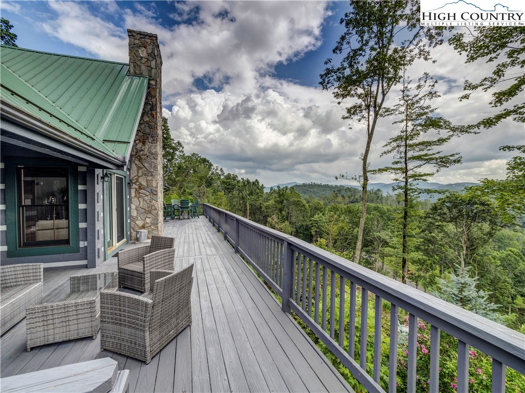 885 John Erwin Road Banner Elk, NC 28604 - Photo 39 of 50 a view of balcony with furniture and wooden floor