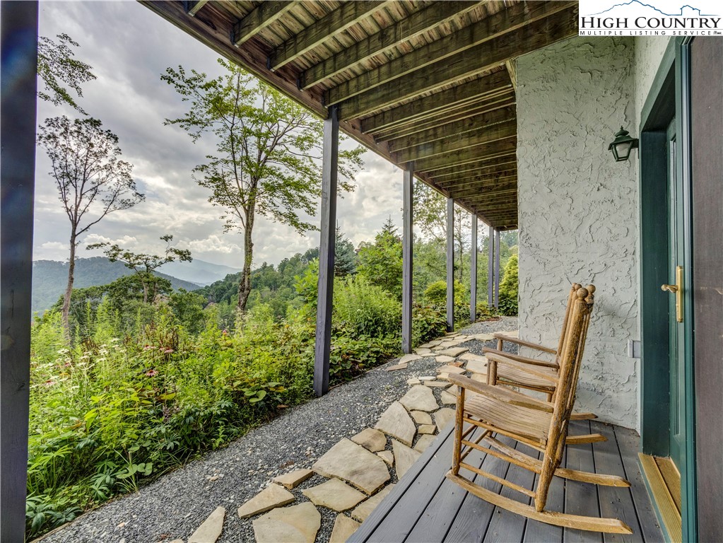 885 John Erwin Road Banner Elk, NC 28604 - Photo 42 of 50 a view of balcony with wooden floor and outdoor seating