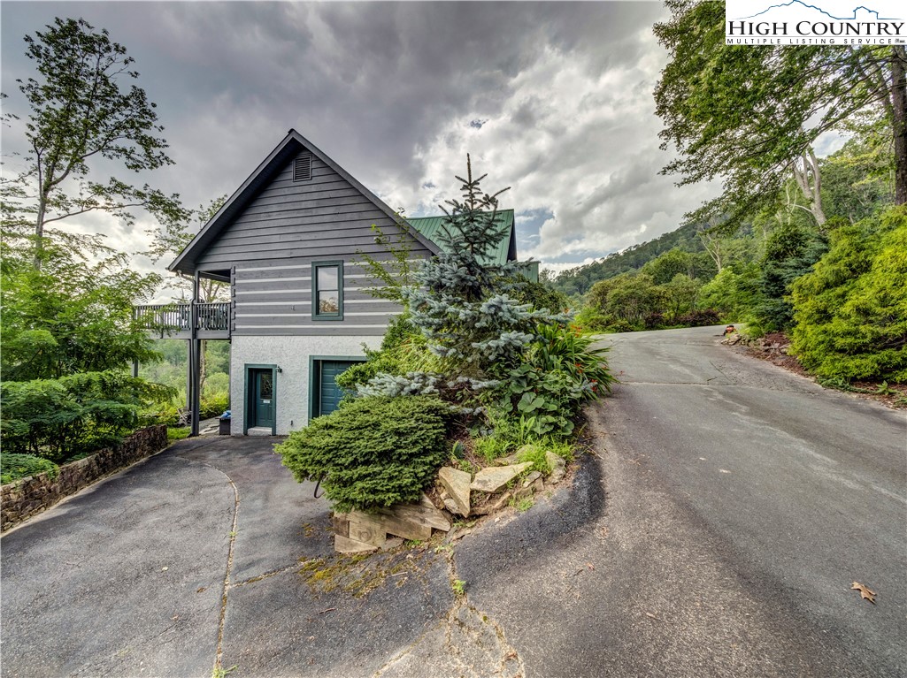 885 John Erwin Road Banner Elk, NC 28604 - Photo 43 of 50 a house with a yard