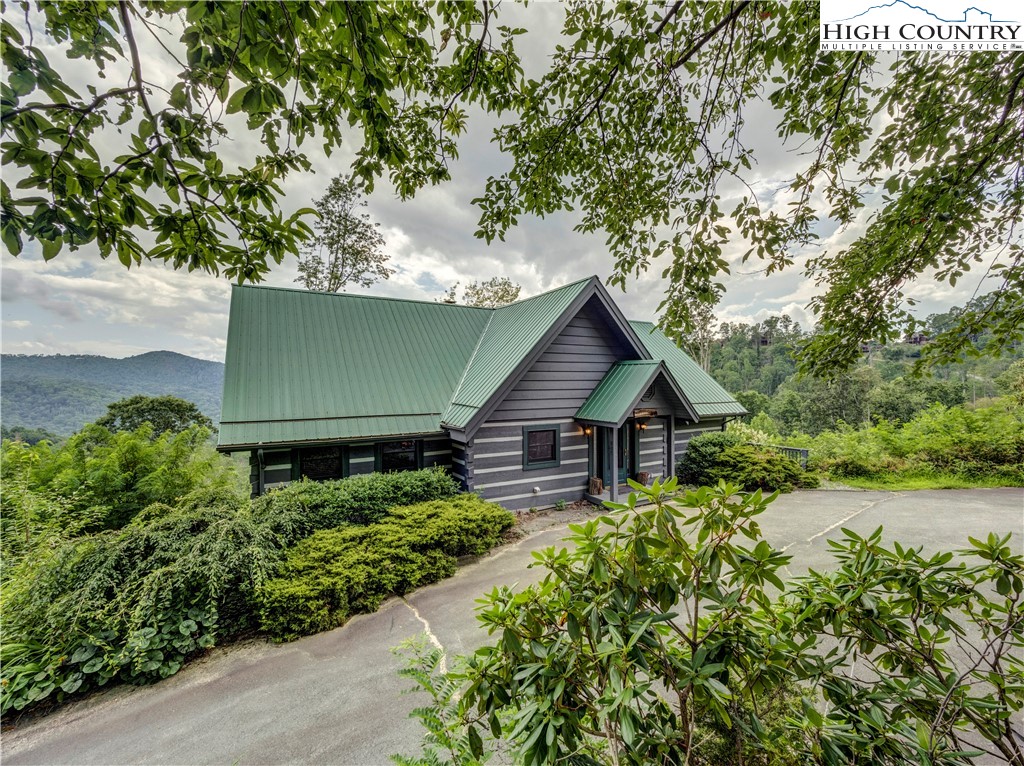 885 John Erwin Road Banner Elk, NC 28604 - Photo 45 of 50 front view of a house with a small yard