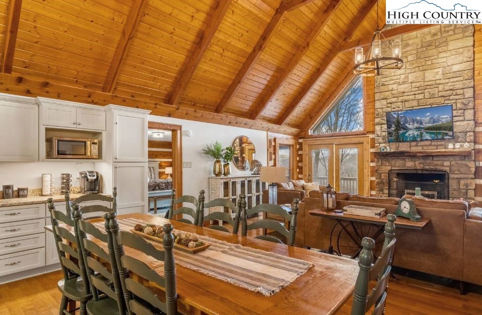 885 John Erwin Road Banner Elk, NC 28604 - Photo 5 of 50 a view of a dining room with furniture window and outside view
