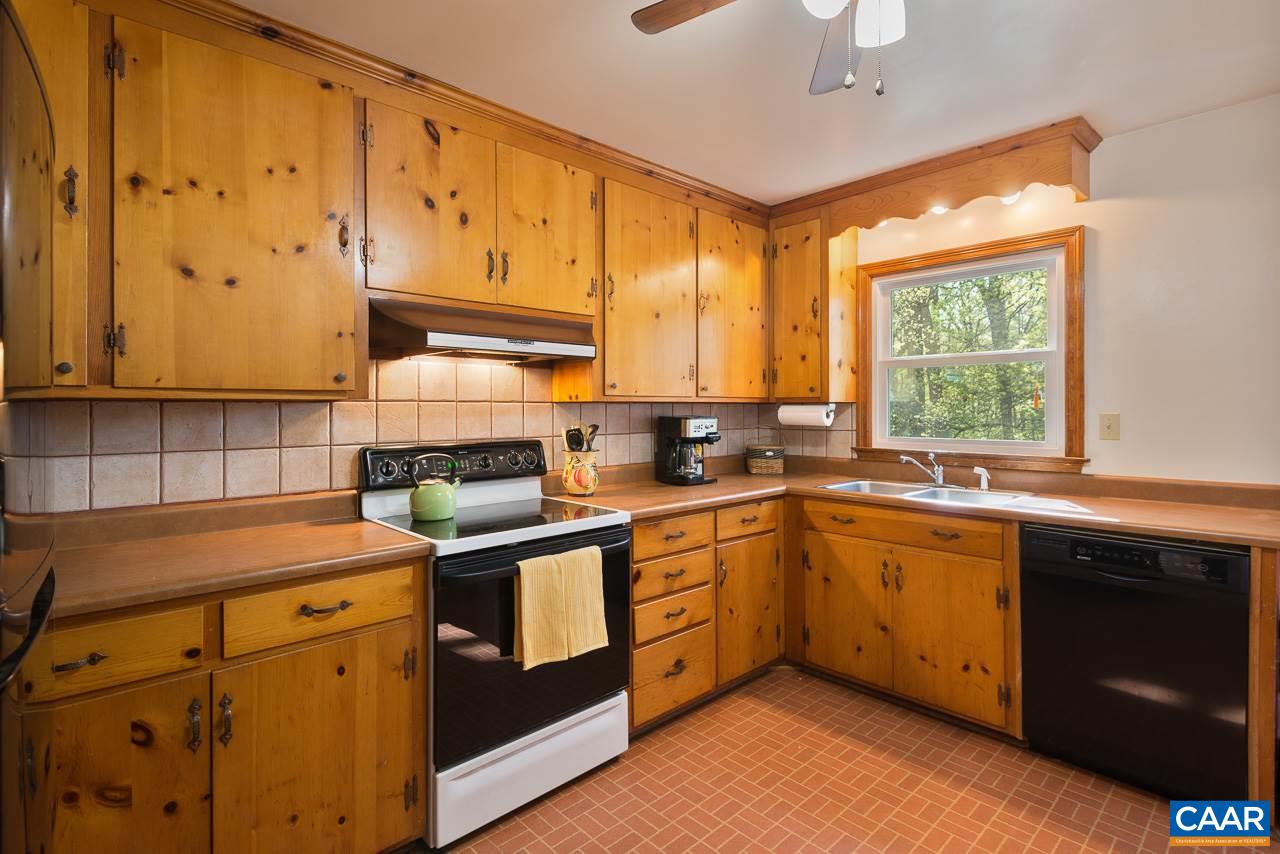 1423 Forest Ridge Road Charlottesville, VA 22903 - Photo 3 of 22 Back when kitchens were made for cooking! Generous counter and cabinet space. Original cabinets in great condition, updated appliances, window over sink overlooks spacious backyard