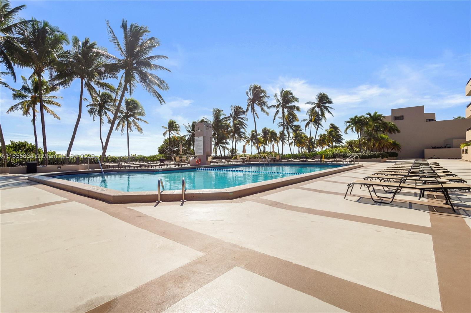 251 Crandon Boulevard, Unit 202 Key Biscayne, FL 33149 - Photo 19 of 24 a view of swimming pool with outdoor seating and plants