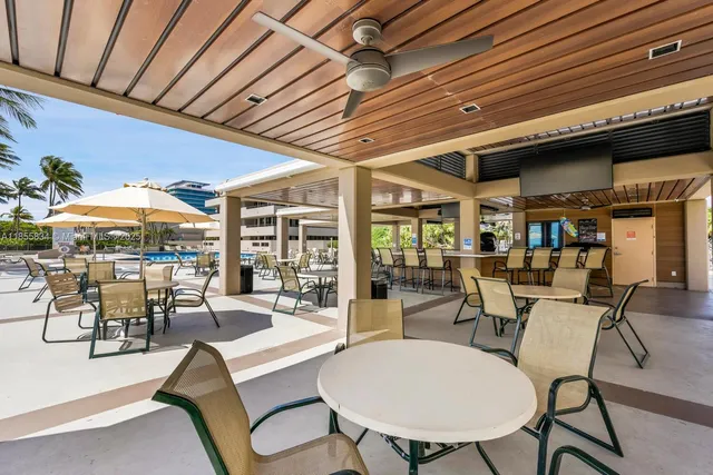 a outdoor space with lots of tables and chairs