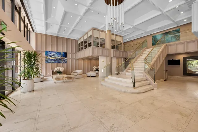 a view of a living room and chandelier