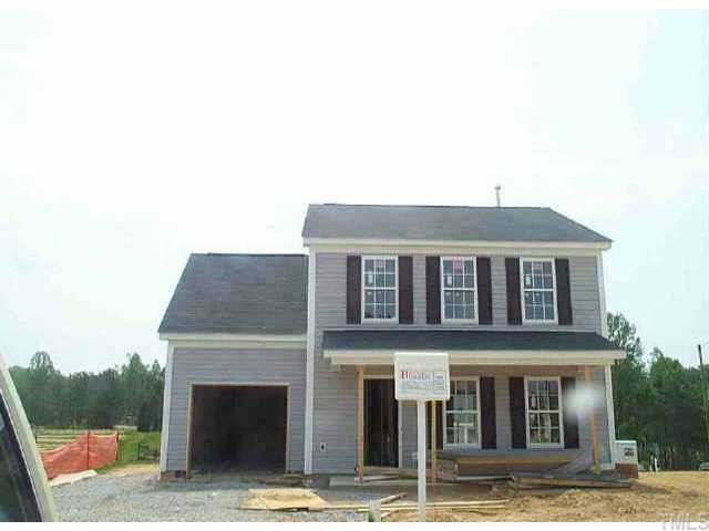 3909 Apperson Drive Raleigh, NC 27610 - Photo 1 of 1 a front view of a house with a garden