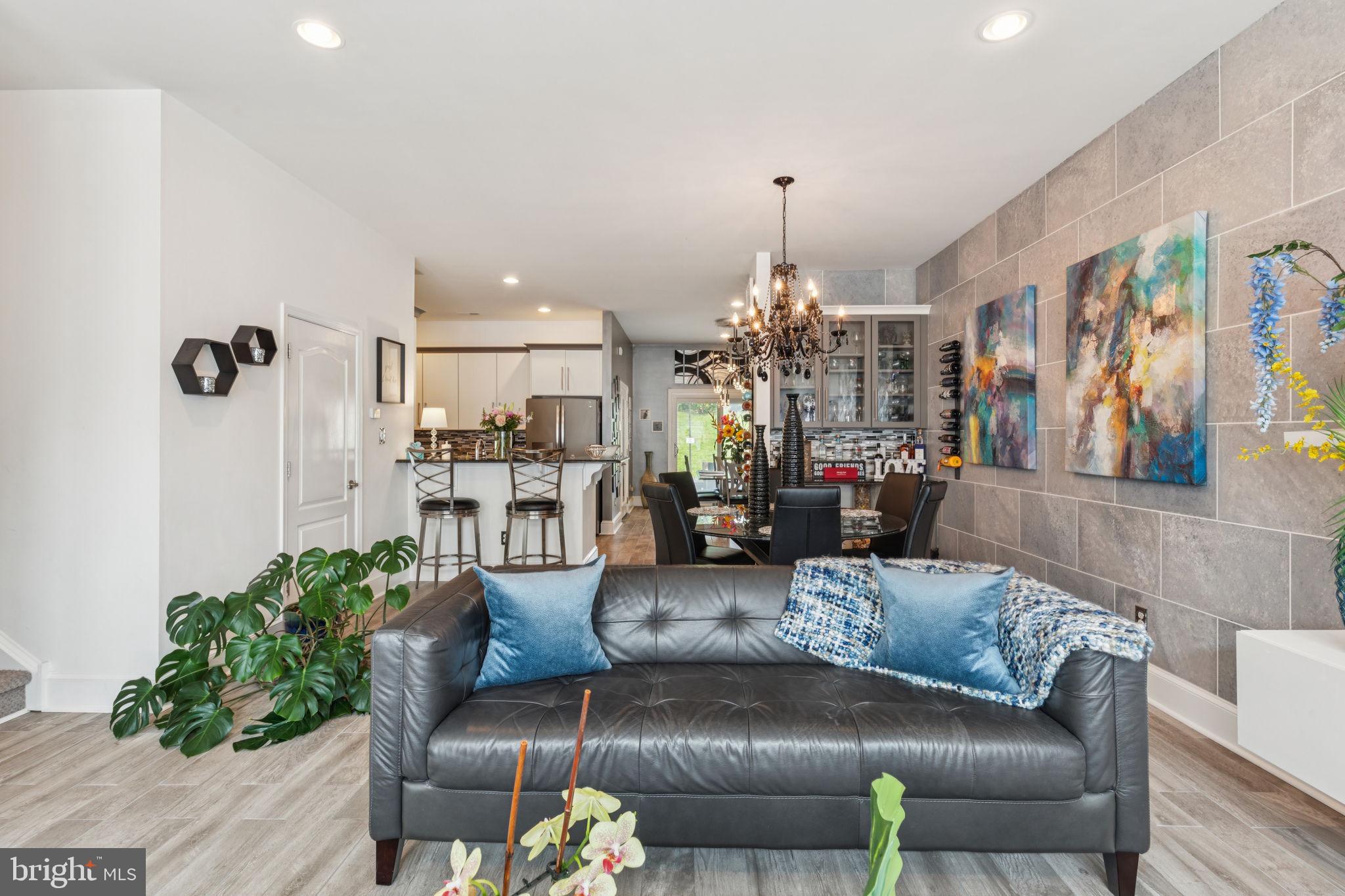 2303 Roma Drive Philadelphia, PA 19145 - Photo 11 of 80 a living room with furniture and a chandelier