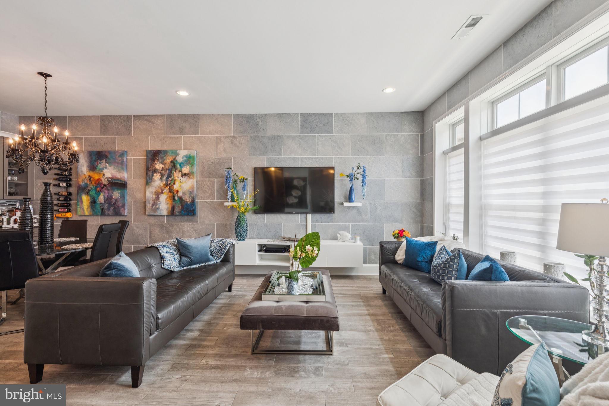 2303 Roma Drive Philadelphia, PA 19145 - Photo 13 of 80 a living room with furniture and a chandelier