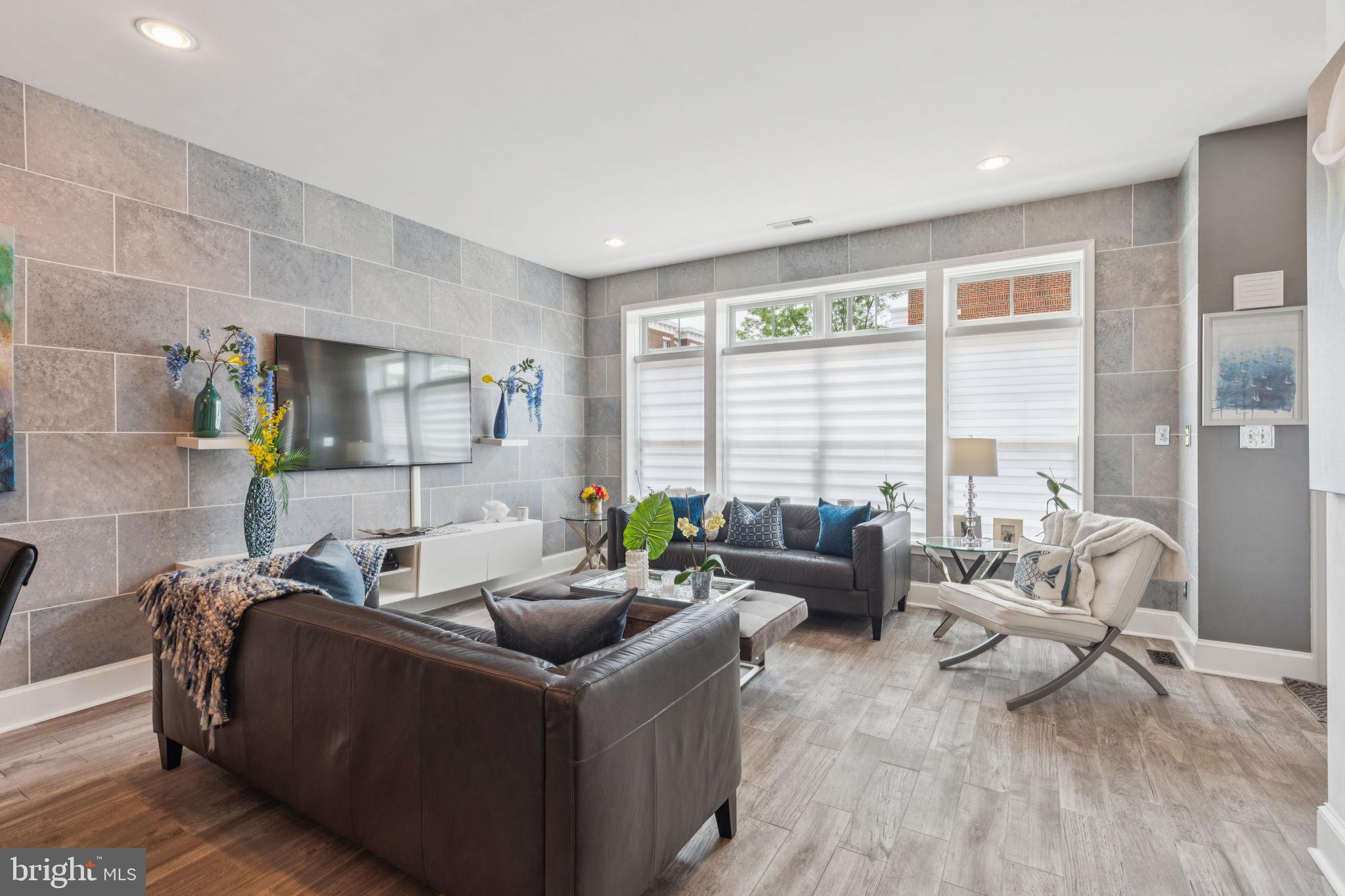 2303 Roma Drive Philadelphia, PA 19145 - Photo 15 of 80 a living room with furniture and a floor to ceiling window