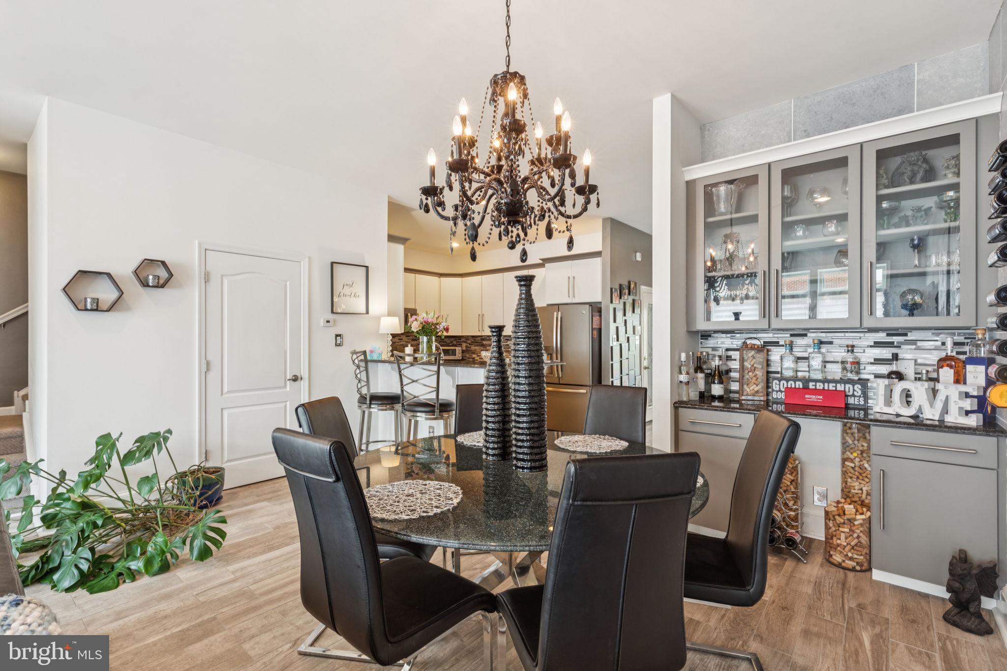 2303 Roma Drive Philadelphia, PA 19145 - Photo 19 of 80 a dining room with furniture potted plants and wooden floor