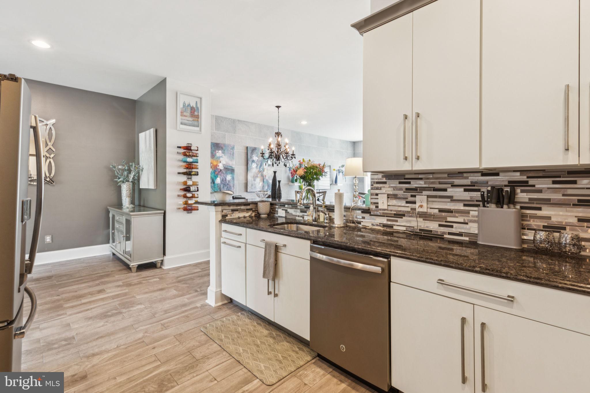 2303 Roma Drive Philadelphia, PA 19145 - Photo 25 of 80 a kitchen with stainless steel appliances granite countertop a sink and cabinets