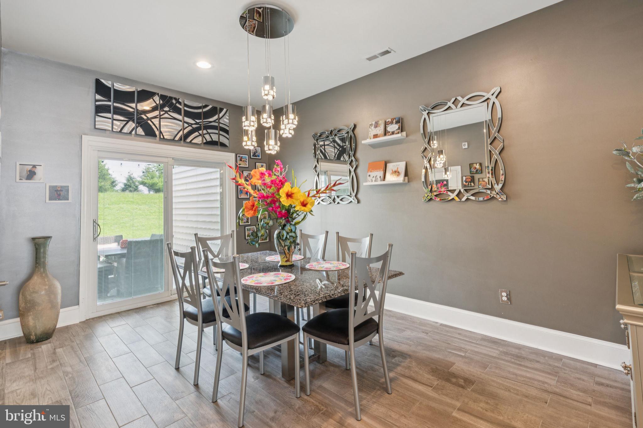 2303 Roma Drive Philadelphia, PA 19145 - Photo 26 of 80 a view of a dining room with furniture and chandelier