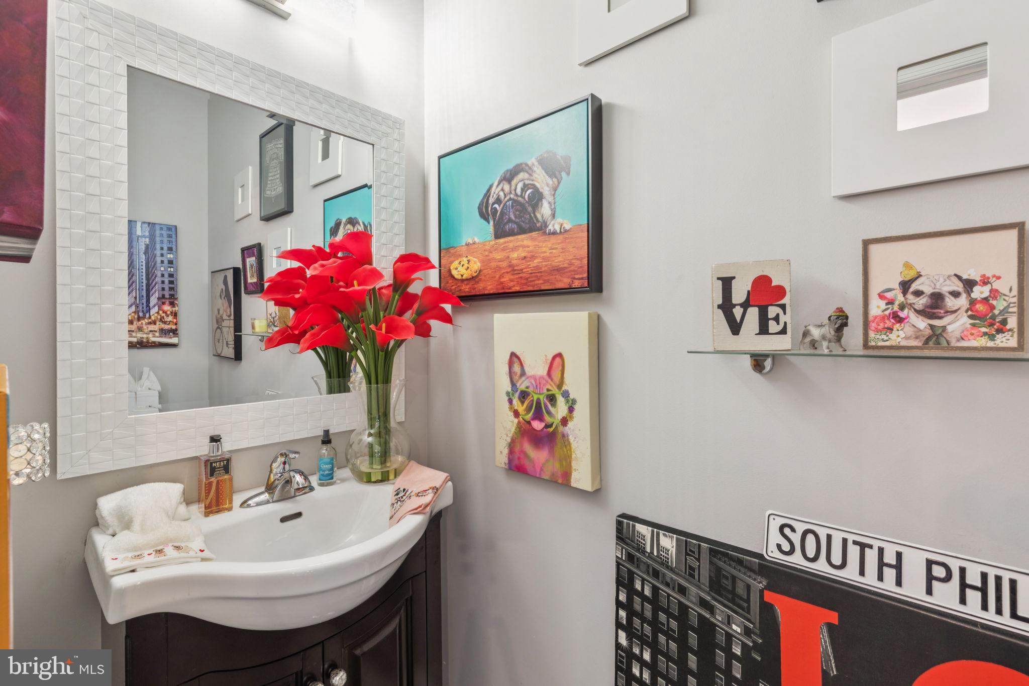 2303 Roma Drive Philadelphia, PA 19145 - Photo 30 of 80 a bathroom with a sink mirror and vanity