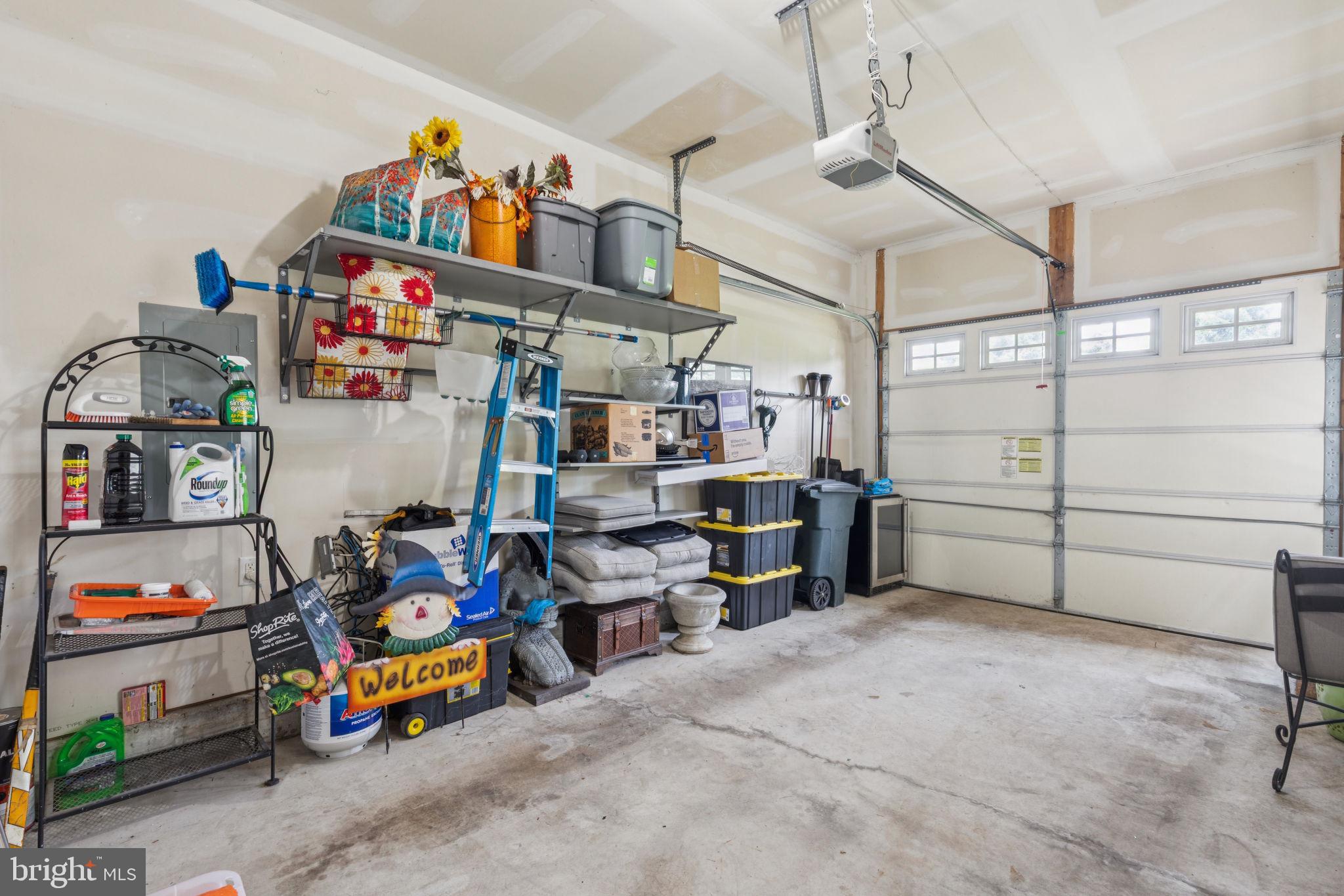 2303 Roma Drive Philadelphia, PA 19145 - Photo 31 of 80 a storage room with lots of clutter and white cabinets