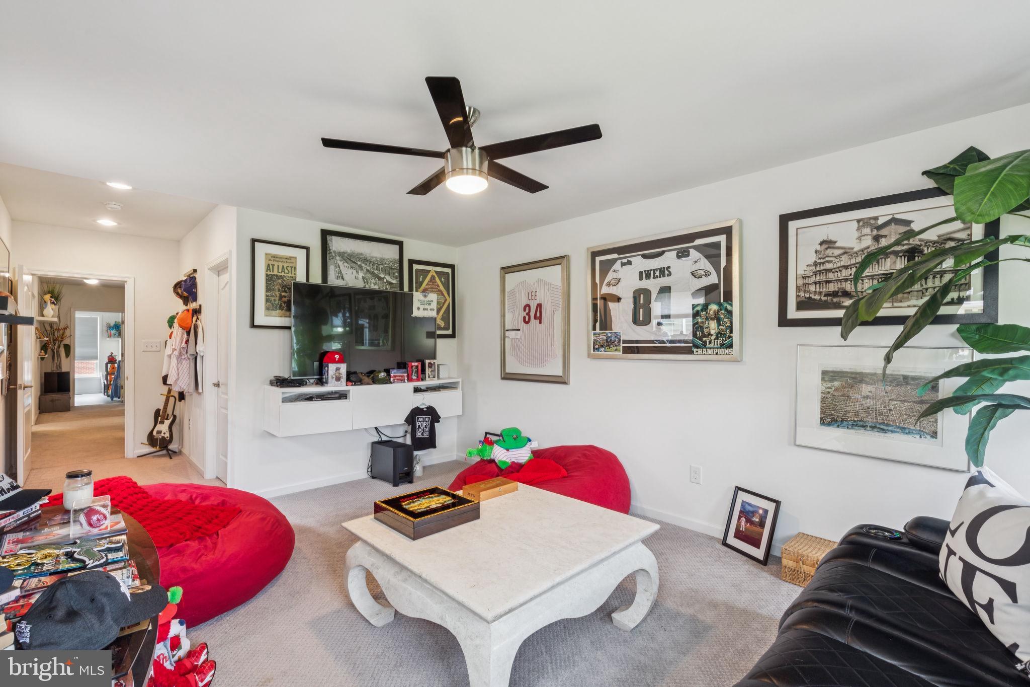 2303 Roma Drive Philadelphia, PA 19145 - Photo 36 of 80 a living room with furniture and a flat screen tv
