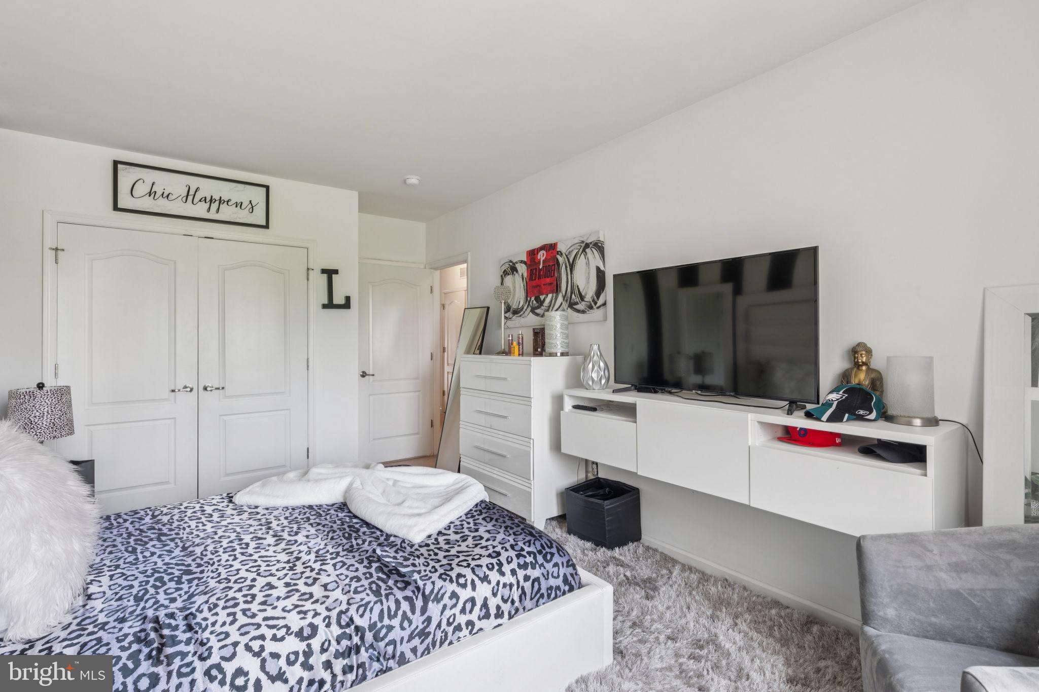 2303 Roma Drive Philadelphia, PA 19145 - Photo 40 of 80 a living room with furniture and a flat screen tv
