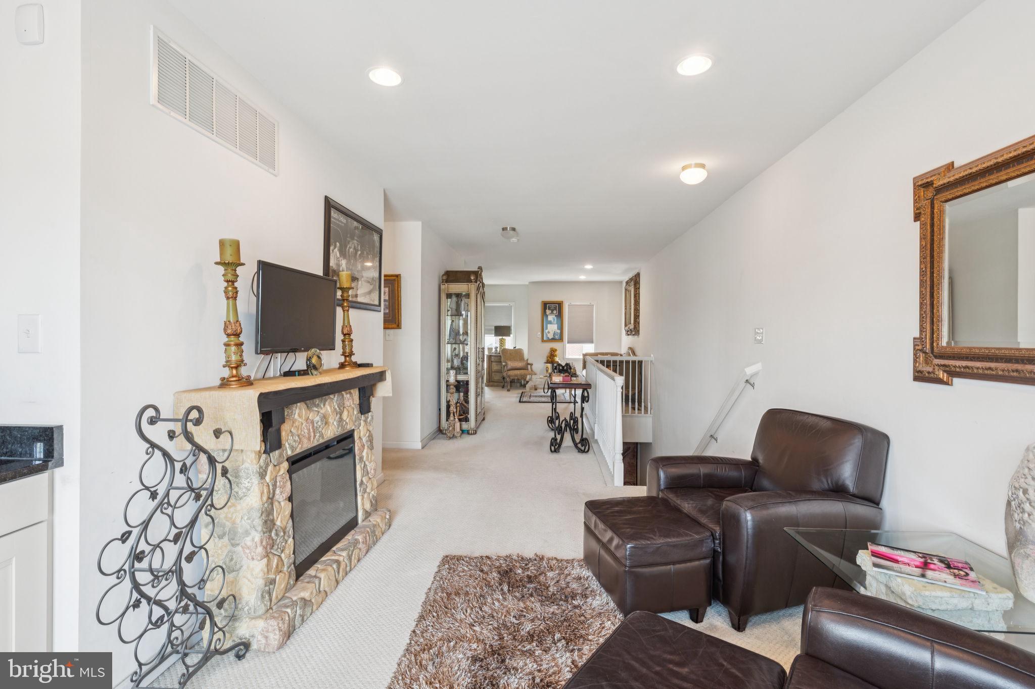 2303 Roma Drive Philadelphia, PA 19145 - Photo 57 of 80 a living room with furniture and a flat screen tv