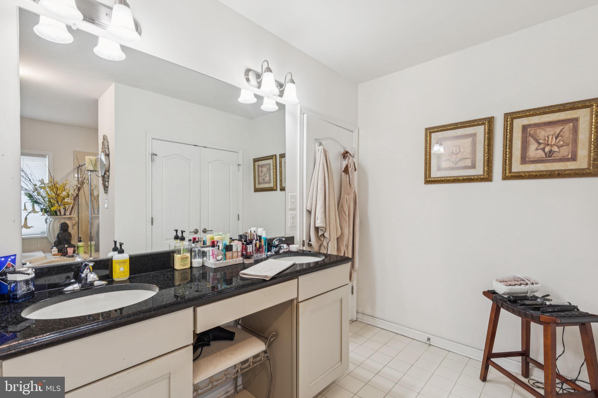 2303 Roma Drive Philadelphia, PA 19145 - Photo 64 of 80 a bathroom with a sink and a mirror